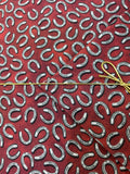Benartex - Yellowstone - Tossed Horseshoes Brick Red Fabric
